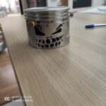 Piston tête de mort souriant